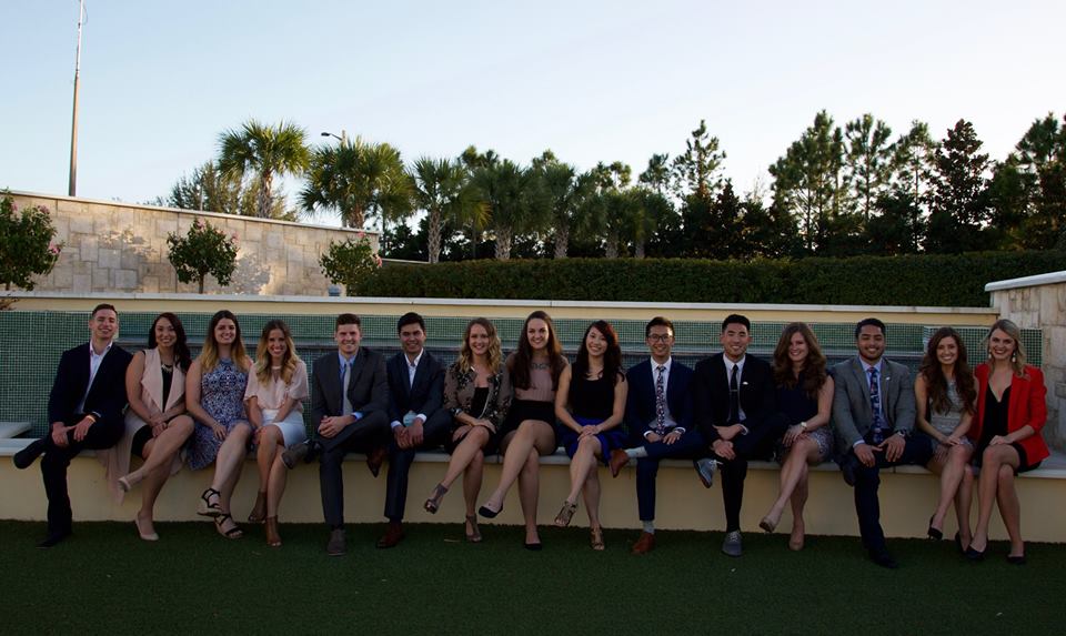 student leaders sitting on ledge