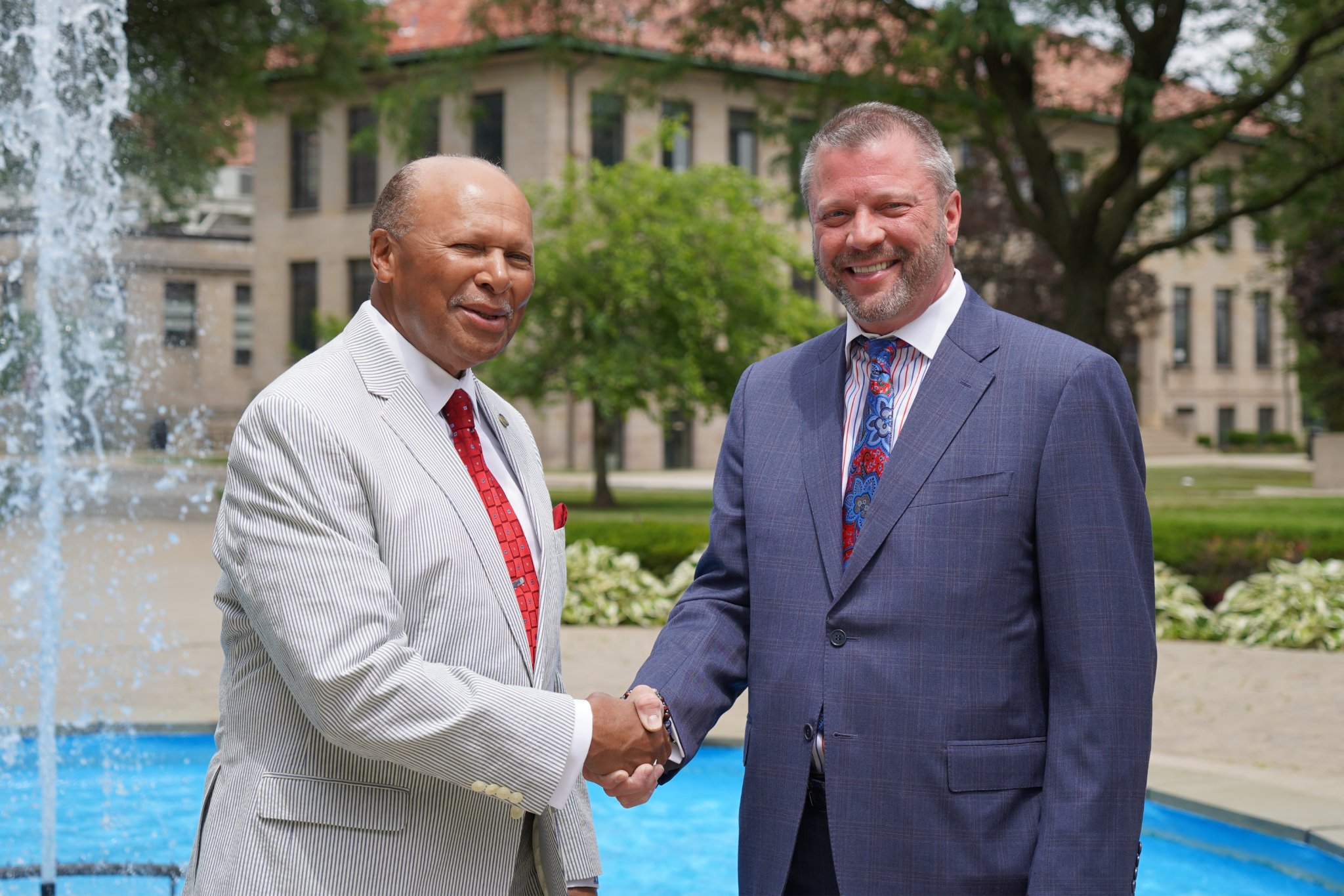 old president shakes hand with new president donald taylor