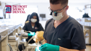 Detroit Mercy Dental dentist student practicing with tools