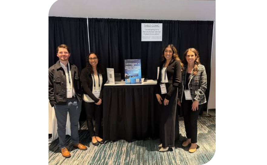 The AEGD Team standing together beside their research poster at the MDA Poster Session, smiling for the camera.