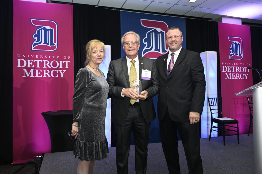 Left to right; Provost Pamela Zarkowski, Dr. William Chase `72 and University President Donald Taylor. Dr. Chase is holding his award.