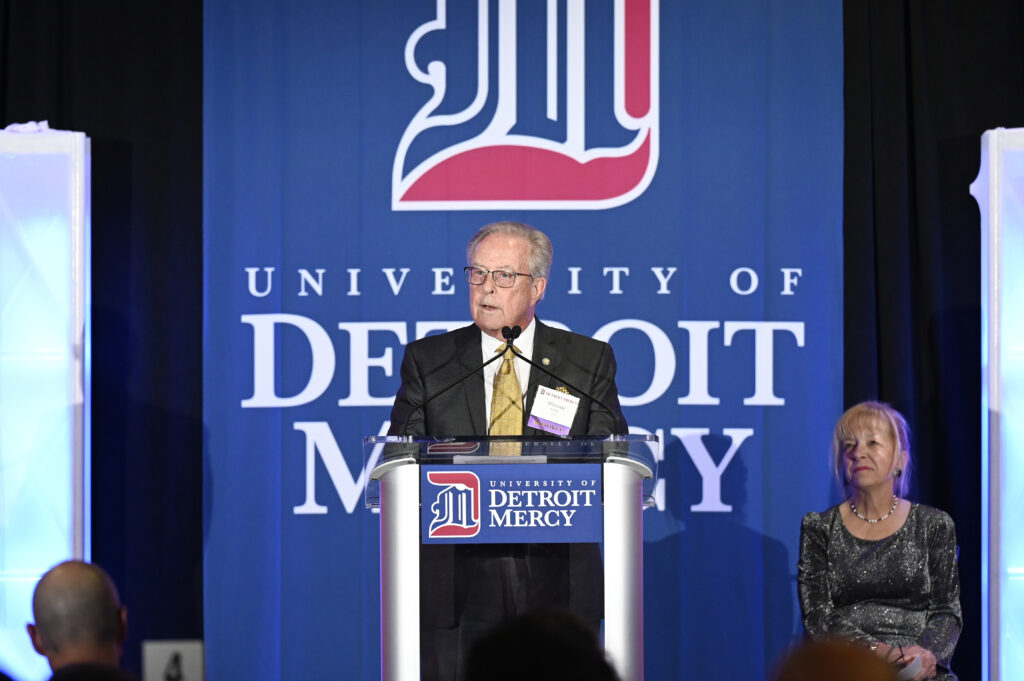 Dr. William Chase at the podium.